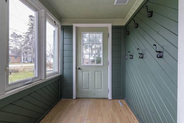 Sunroom: Glassed-in front porch with coat hooks