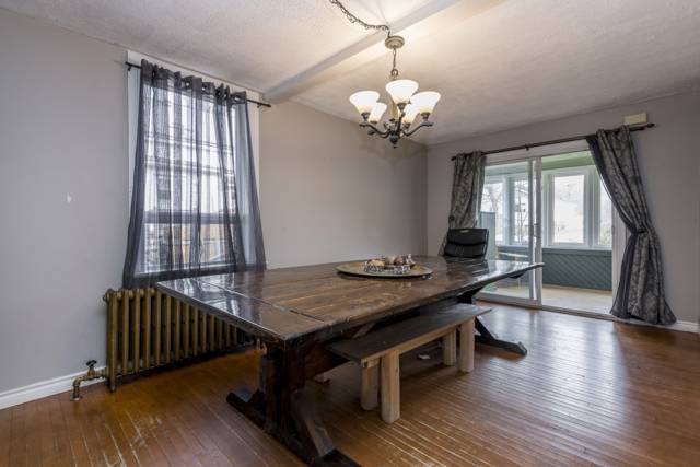 Dining room: Original hardwood and a cast-iron radiator