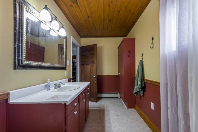 Bathroom: Long vanity and linen storage